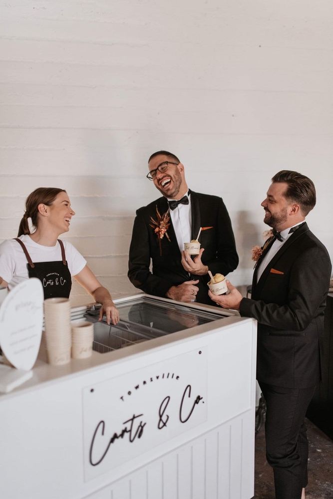 Guests laughing with the attendant at the Carts & Co gelato cart